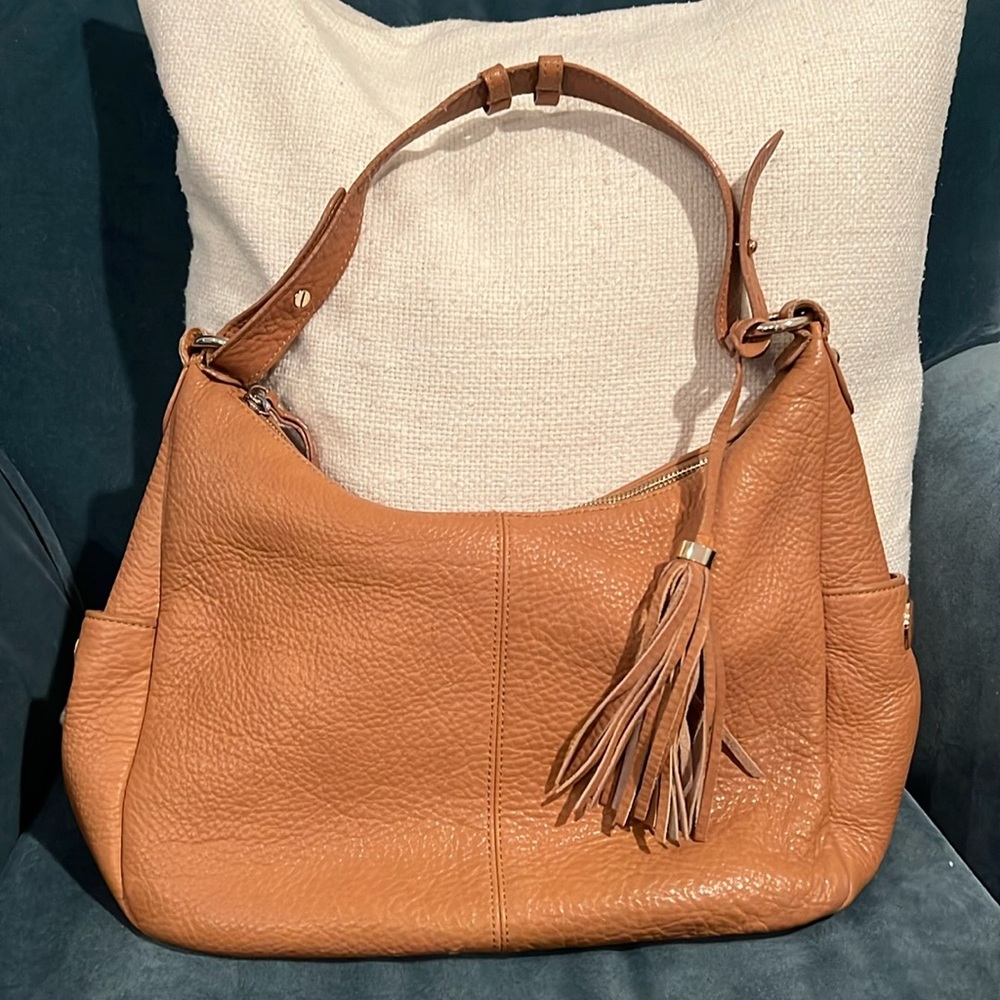 Isaac Mizrahii brown pebble leather shoulder bag. Good hardware. Brown interior